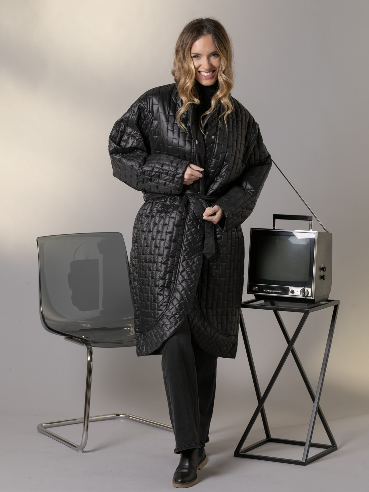 Checkered padded coat with low detail  Black colour