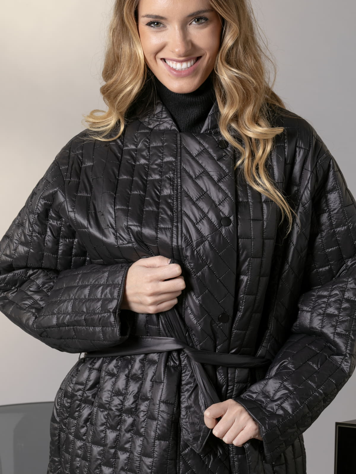 Checkered padded coat with low detail  Black colour