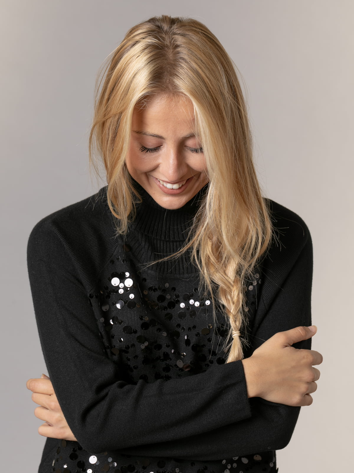 Soft sweater with party appliqués and back wrap  Black colour