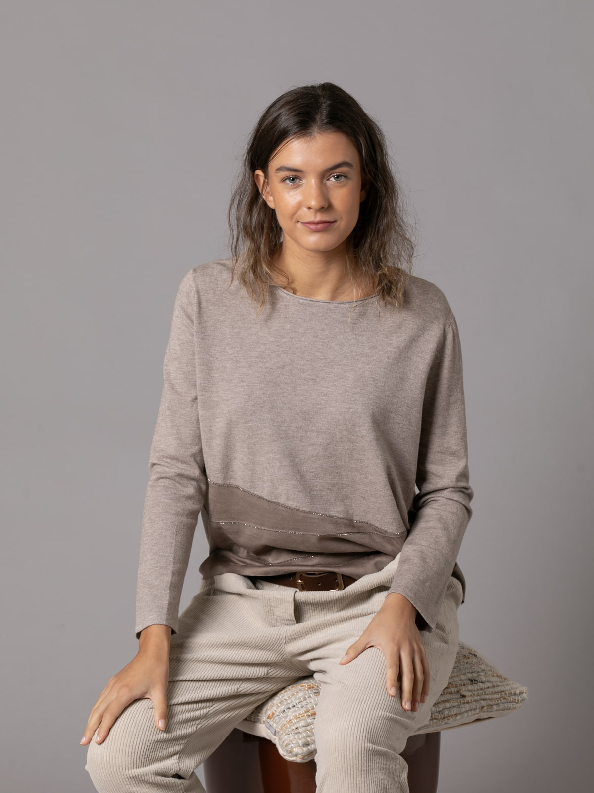 Soft trendy sweater with eco-leather detail on the hem  Taupe colour