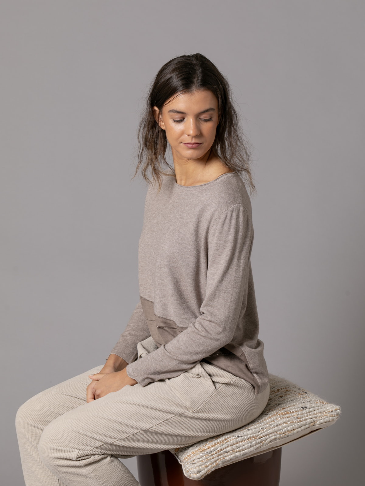 Soft trendy sweater with eco-leather detail on the hem  Taupe colour