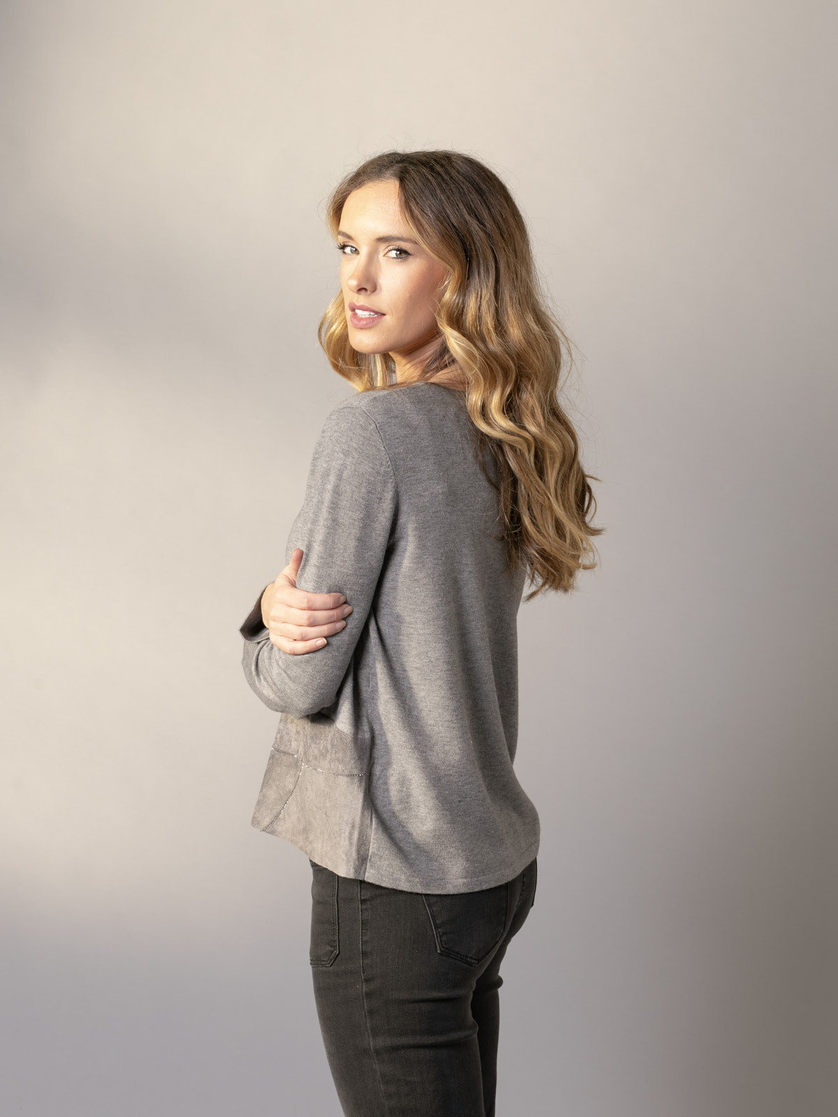 Soft trendy sweater with eco-leather detail on the hem  Grey colour