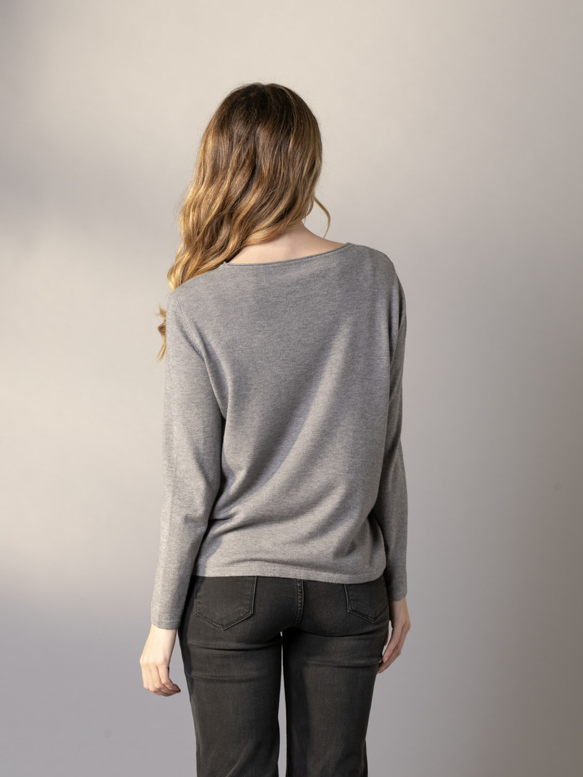 Soft trendy sweater with eco-leather detail on the hem  Grey colour