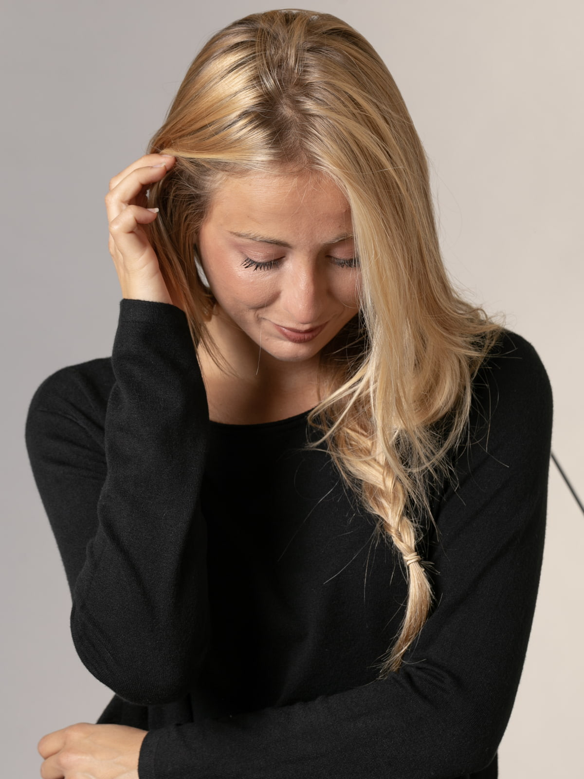 Soft trendy sweater with eco-leather detail on the hem  Black colour