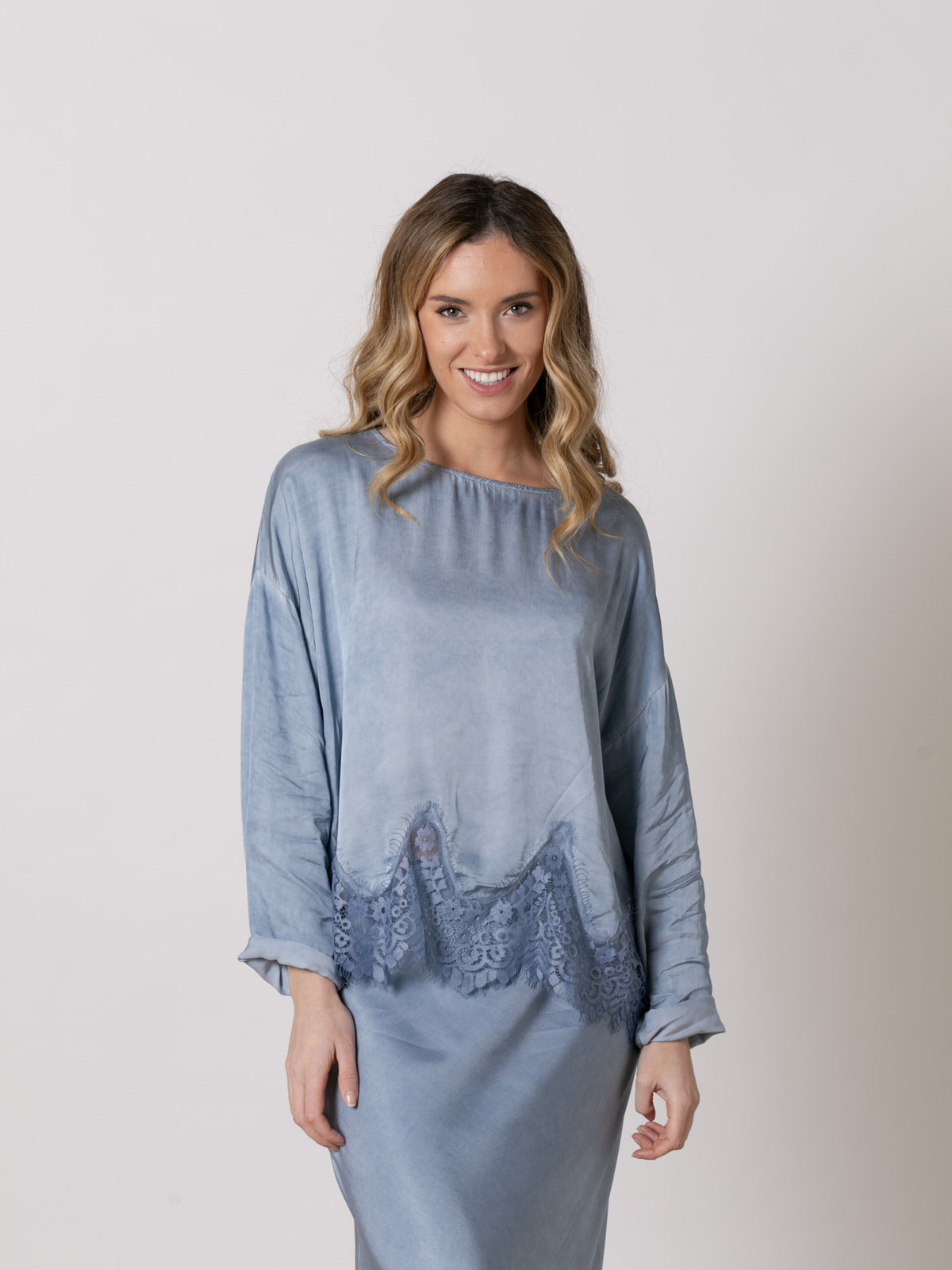 Flowing shirt with lace at the bottom  Blue colour