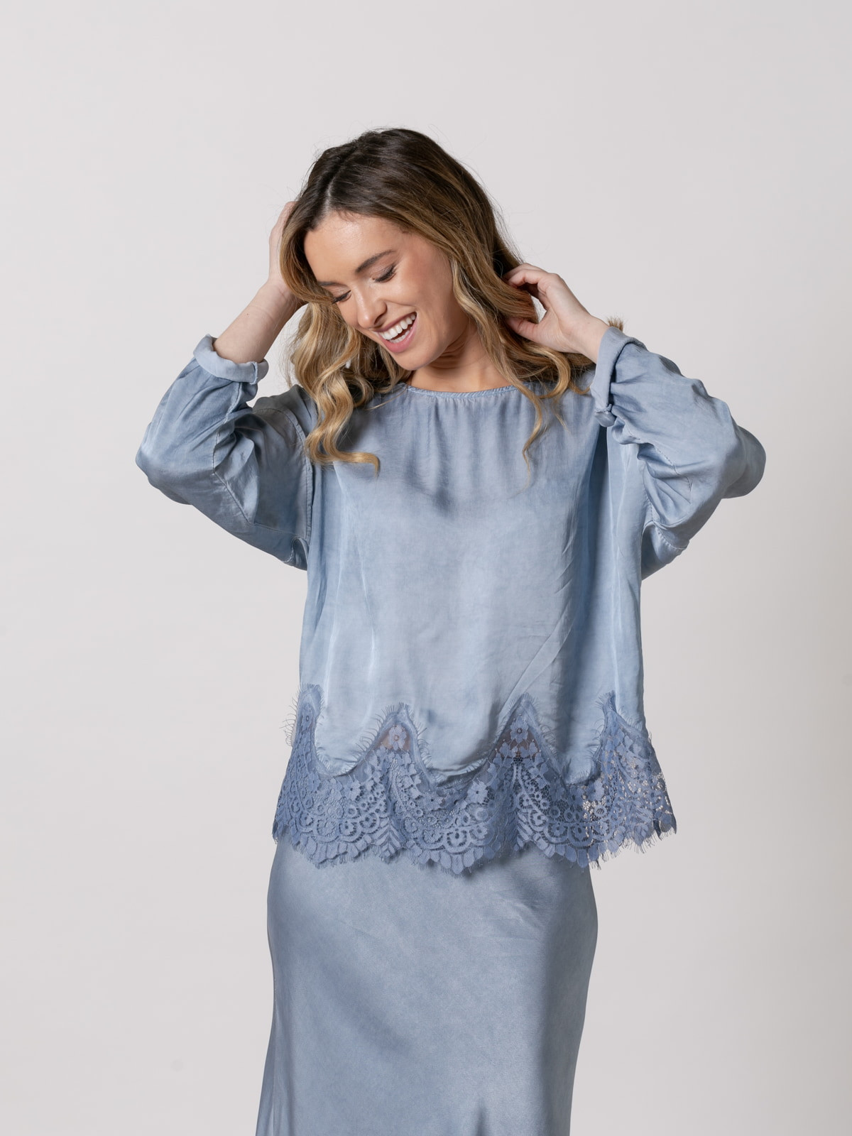 Flowing shirt with lace at the bottom  Blue colour