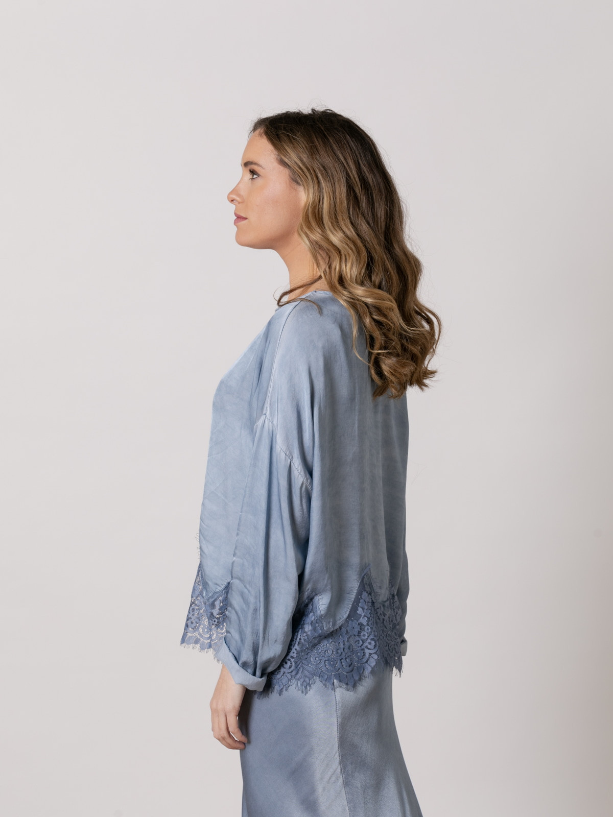 Flowing shirt with lace at the bottom  Blue colour